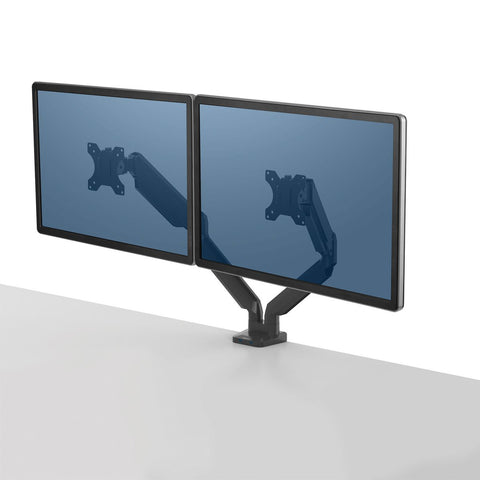 DeskStand Fellowes Platinum Series Dual Monitor Arm mounted on a desk, holding two monitors side by side with fully extended adjustable arms.