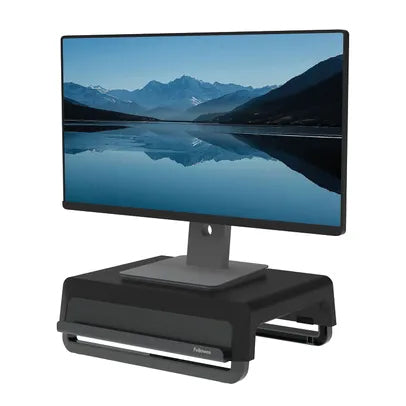 Front angle view of the black DeskStand Fellowes Breyta monitor stand with stacked leg supports in lowest position, showing minimal profile, clean edges and monitor on top.